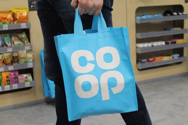 Photo of a Co-operative Group cloverleaf branded reusable shopping bag. Promotional product marketing examples with the reasoning laid bare